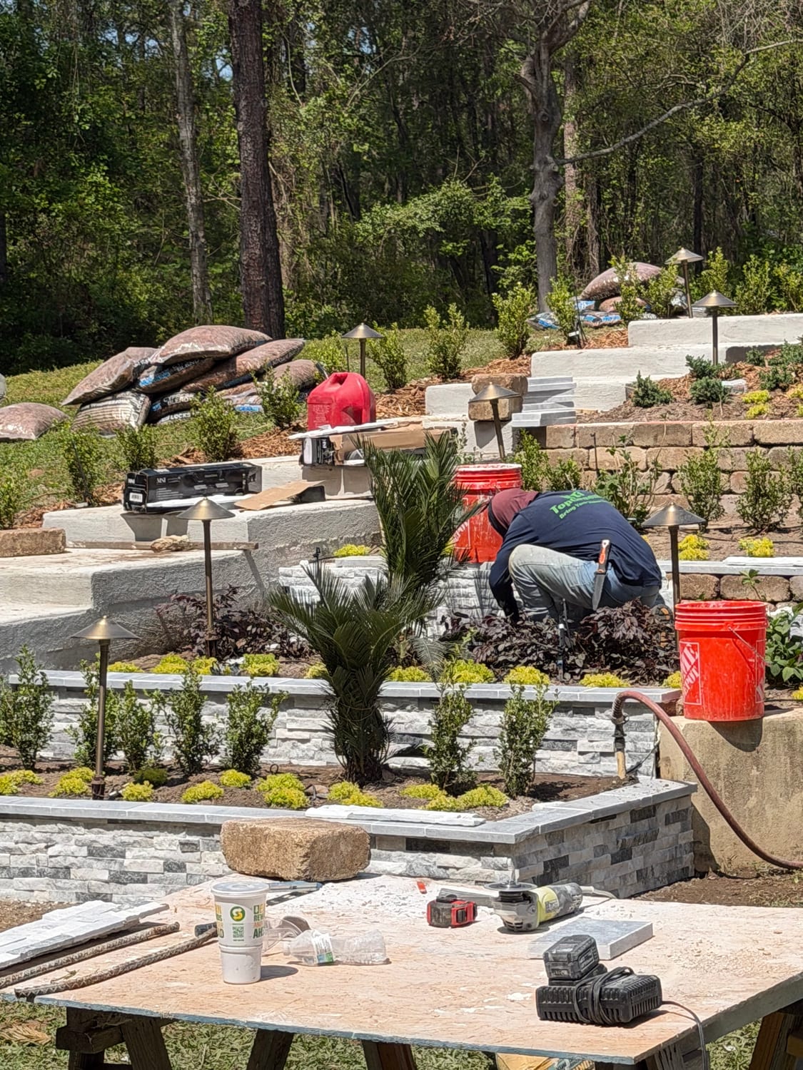 Stonework and planting on a tiered hardscape project